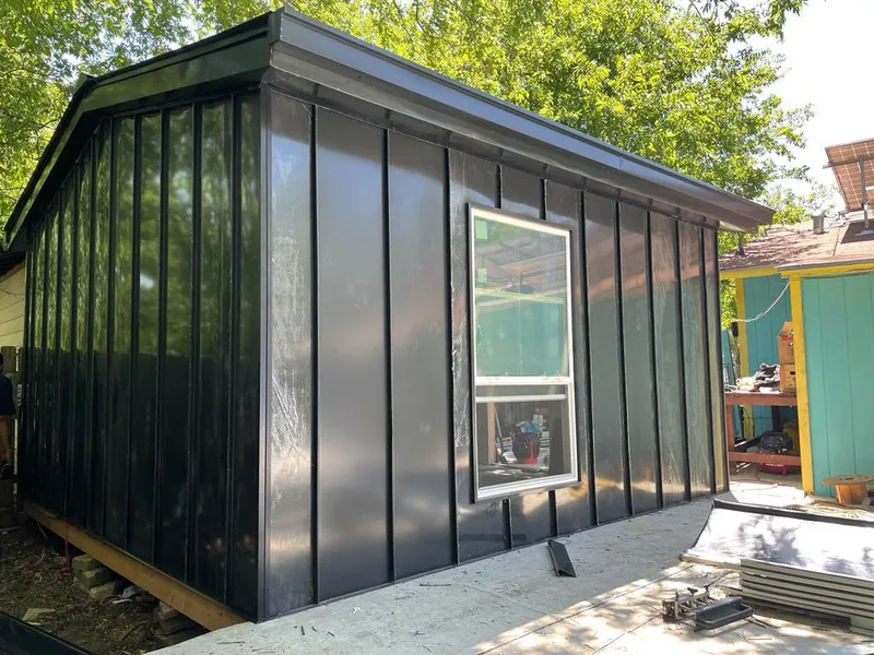 Black standing seam metal wall panels for Roof Inspection in Patchogue